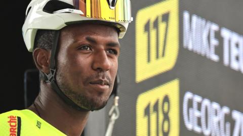 Biniam Girmay poses next to a timing screen at the Tour de France