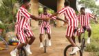 Street children practice acrobatics on unicycles in Lagos, Nigeria - Monday 14 August 2023