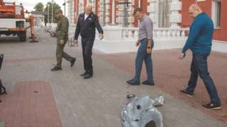Governor of the Kursk Region Roman Starovoit inspects a damaged railway station following a reported drone attack in Kursk