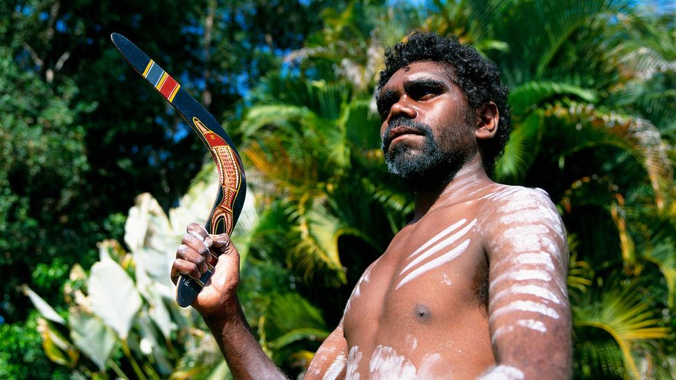 Man holding a boomerang